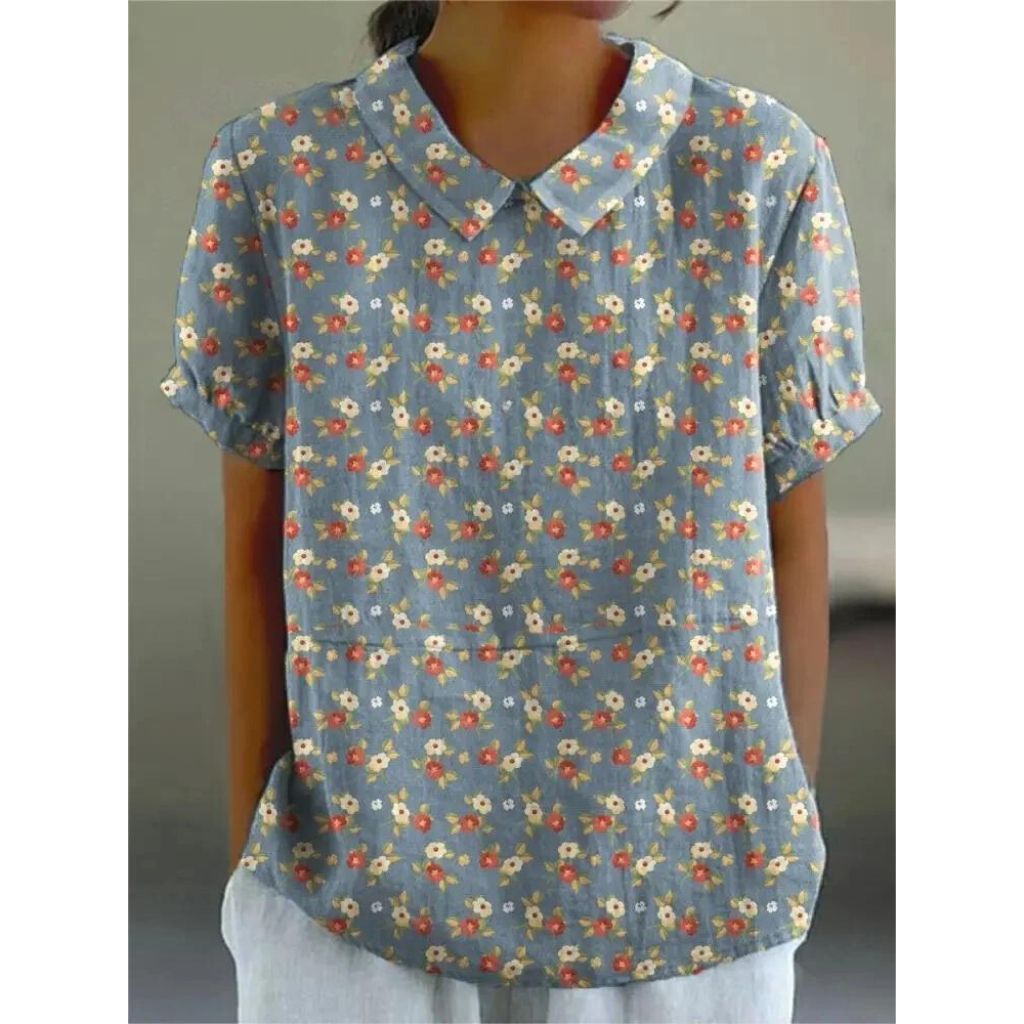 Lässige Damenbluse mit floralem Print, aus leichter Baumwolle, Rundhals und kurzen Ärmeln für sommerliche Tage.