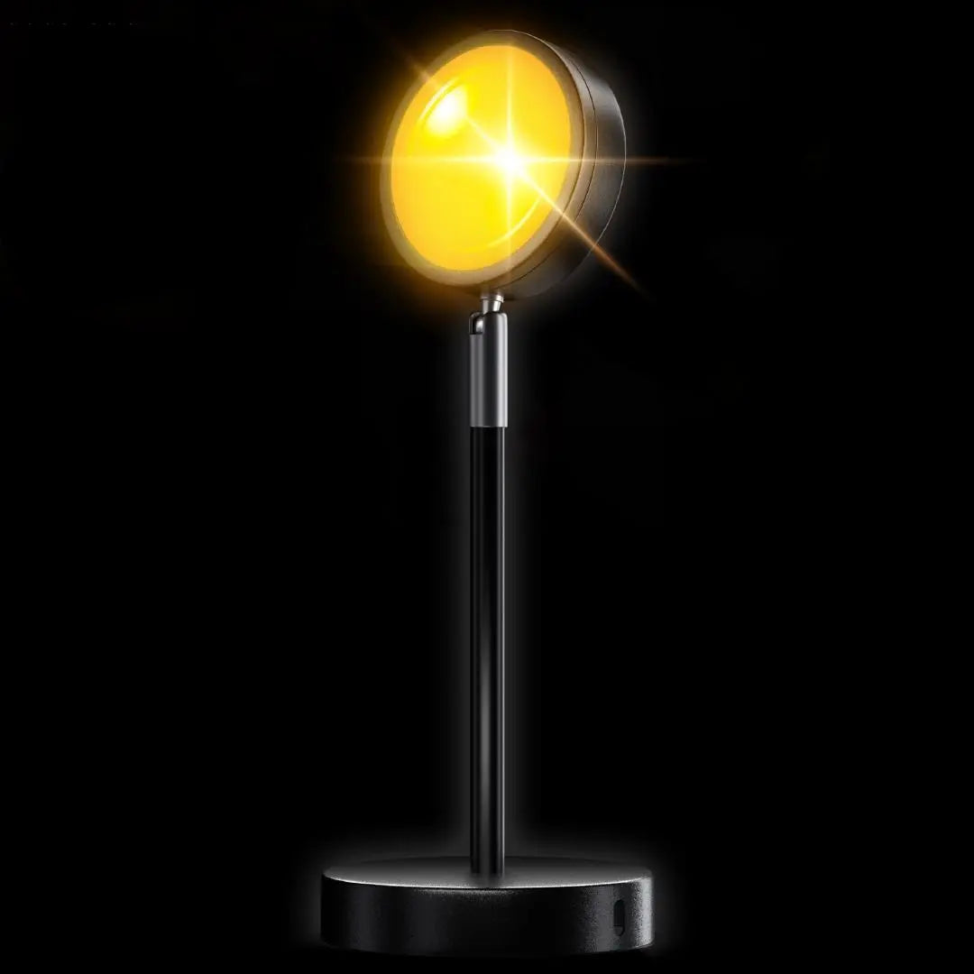 "LED-Projektionslampe mit Sonnenuntergangsfarben, kompakt und modern, schafft stimmungsvolle Beleuchtung auf Tischen"