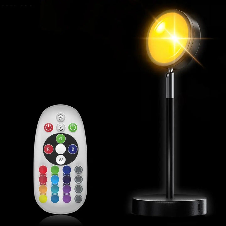 "LED-Projektionslampe mit Sonnenuntergangsfarben, kompakt und modern, schafft stimmungsvolle Beleuchtung auf Tischen"