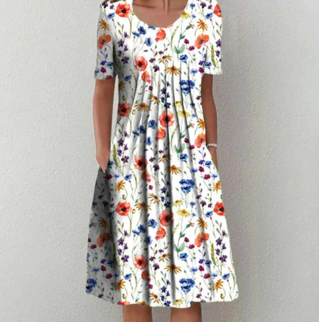 "Leichtes Damen Sommerkleid mit lebhaften Drucken, Midi-Länge, ideal für warme Tage und modische Auftritte."
