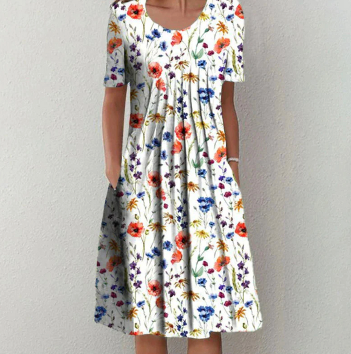 "Leichtes Damen Sommerkleid mit lebhaften Drucken, Midi-Länge, ideal für warme Tage und modische Auftritte."