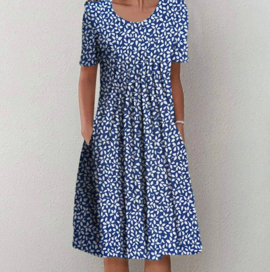 "Leichtes Damen Sommerkleid mit lebhaften Drucken, Midi-Länge, ideal für warme Tage und modische Auftritte."