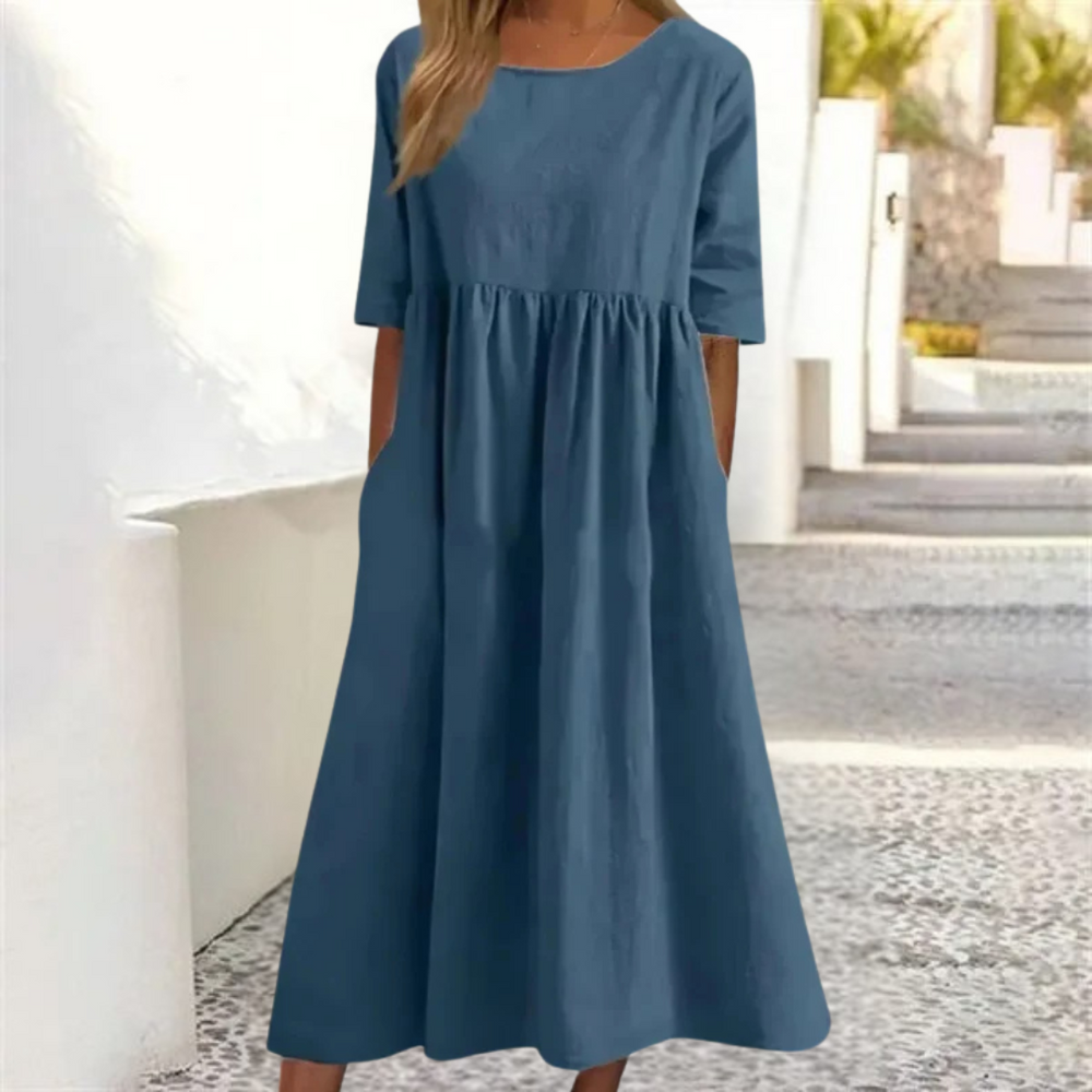 Leichtes Midi-Sommerkleid Damen, luftig und komfortabel, in hellem Farbton, mit lockerer Passform und Seitentaschen.