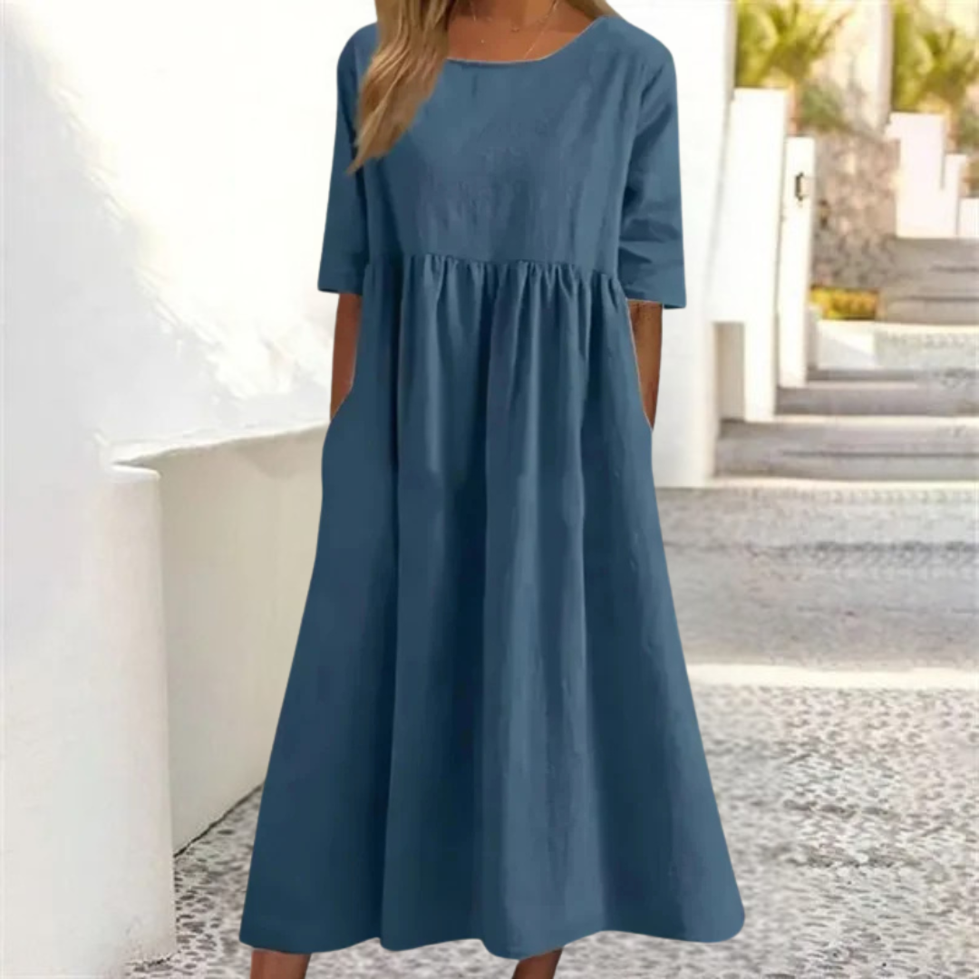 Leichtes Midi-Sommerkleid Damen, luftig und komfortabel, in hellem Farbton, mit lockerer Passform und Seitentaschen.