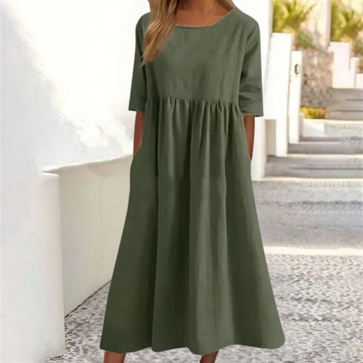 Leichtes Midi-Sommerkleid Damen, luftig und komfortabel, in hellem Farbton, mit lockerer Passform und Seitentaschen.