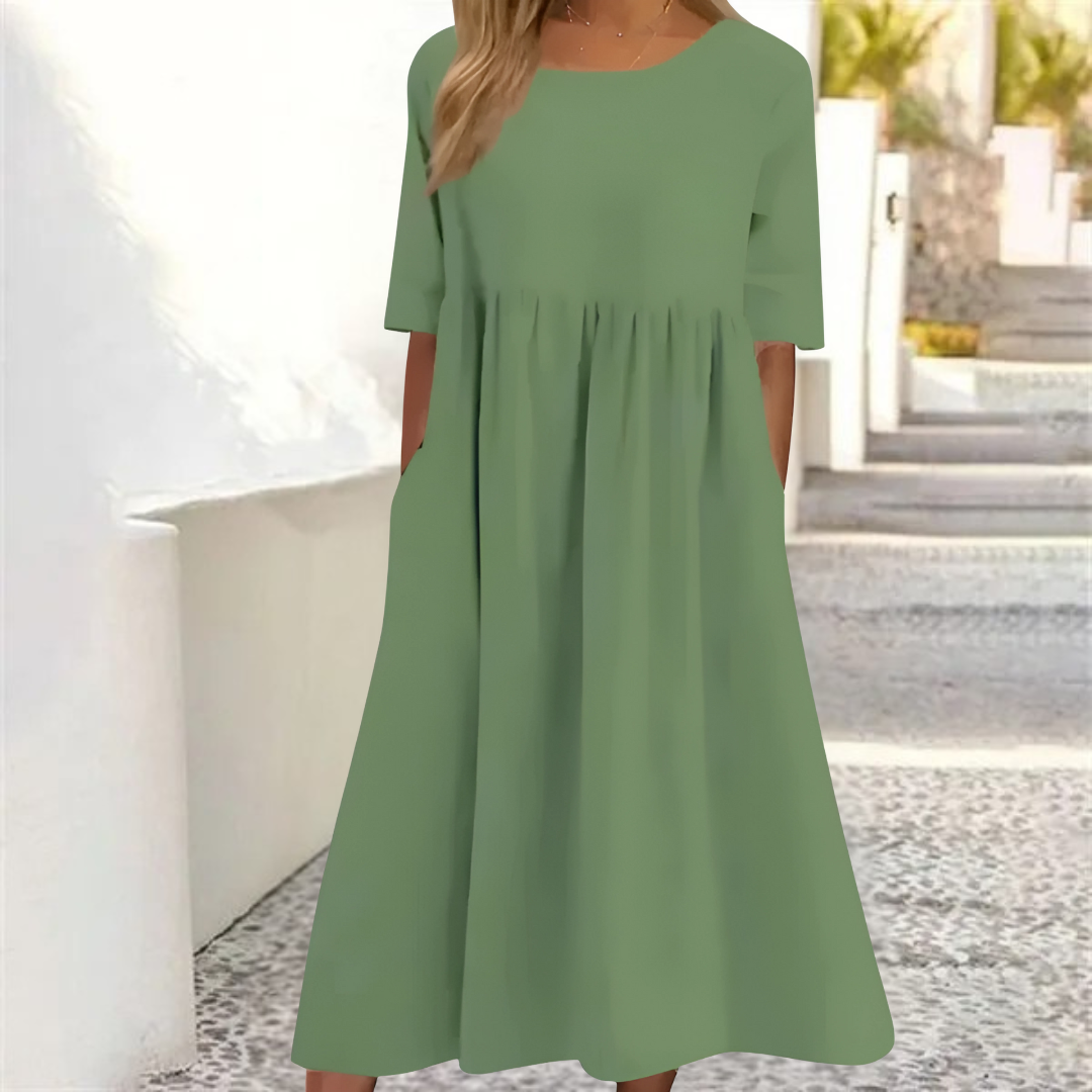Leichtes Midi-Sommerkleid Damen, luftig und komfortabel, in hellem Farbton, mit lockerer Passform und Seitentaschen.