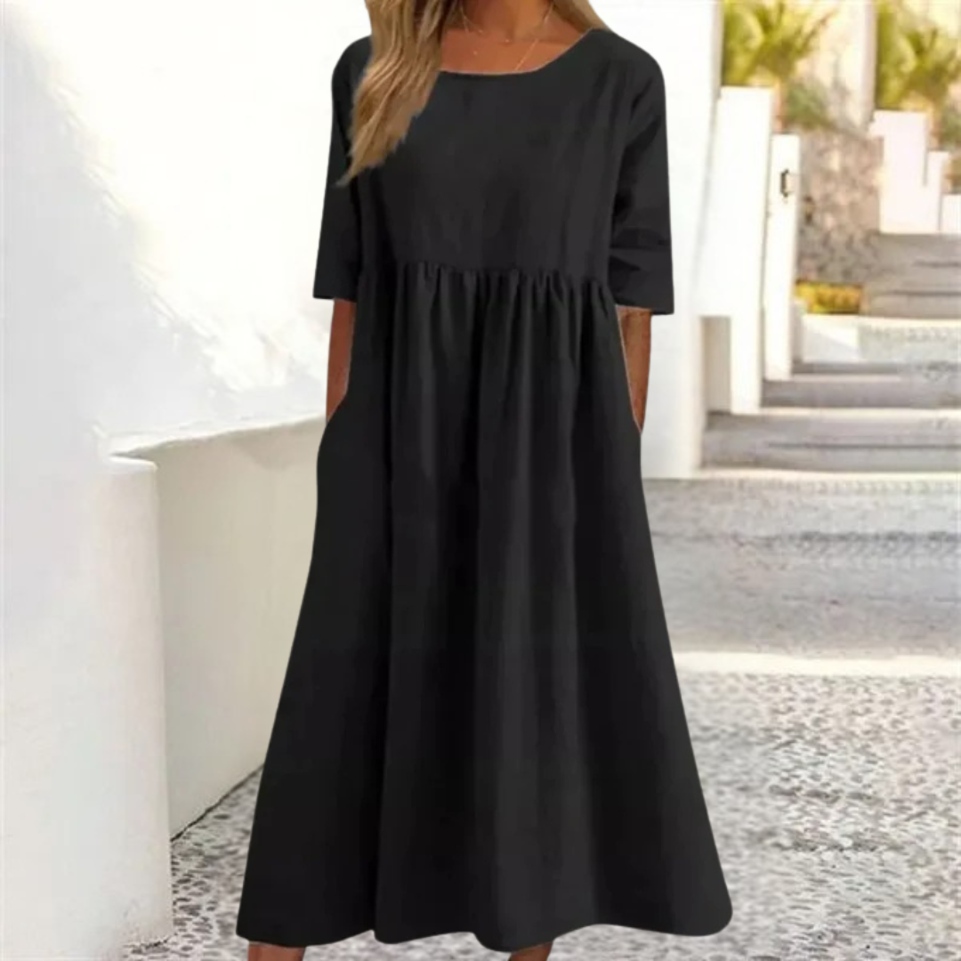 Leichtes Midi-Sommerkleid Damen, luftig und komfortabel, in hellem Farbton, mit lockerer Passform und Seitentaschen.