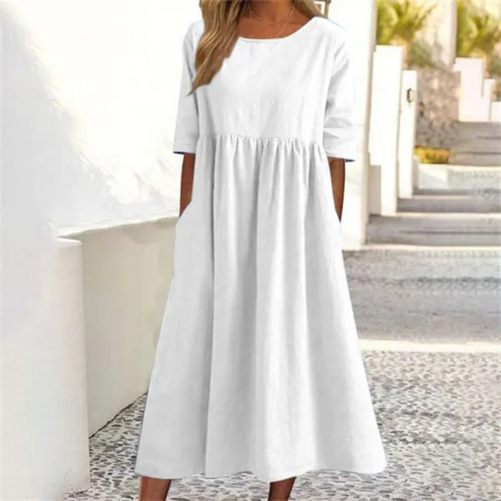 Leichtes Midi-Sommerkleid Damen, luftig und komfortabel, in hellem Farbton, mit lockerer Passform und Seitentaschen.