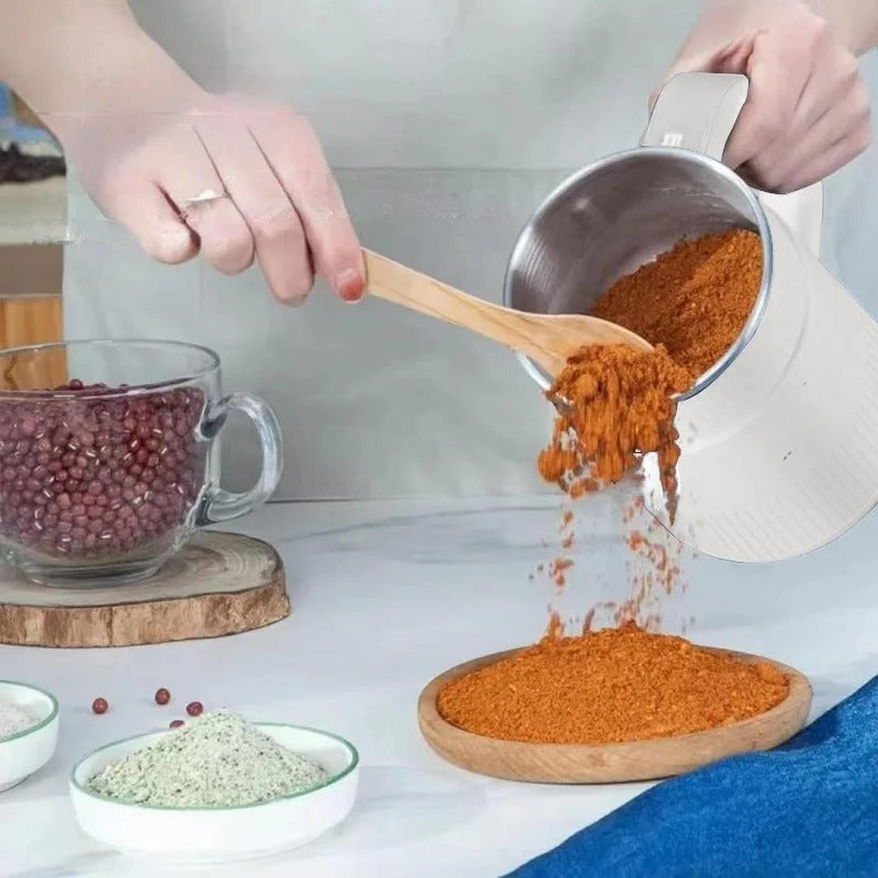 "Leistungsstarke Getreidemühle aus Edelstahl, mahlt Körner zu feinem Mehl, mit modernem Design, ideal für die Küche."