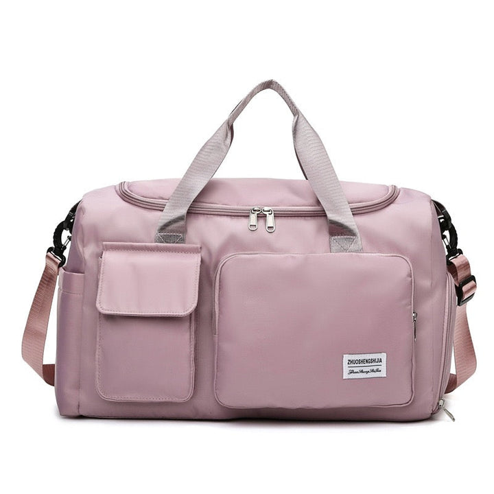 "Lila Damen-Reisetasche mit Schuhfach und mehreren Taschen, ideal für Reisen und Sport, robust und wasserdicht."