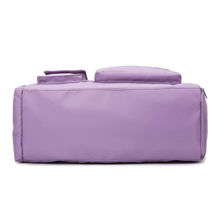 "Lila Damen-Reisetasche mit Schuhfach und mehreren Taschen, ideal für Reisen und Sport, robust und wasserdicht."