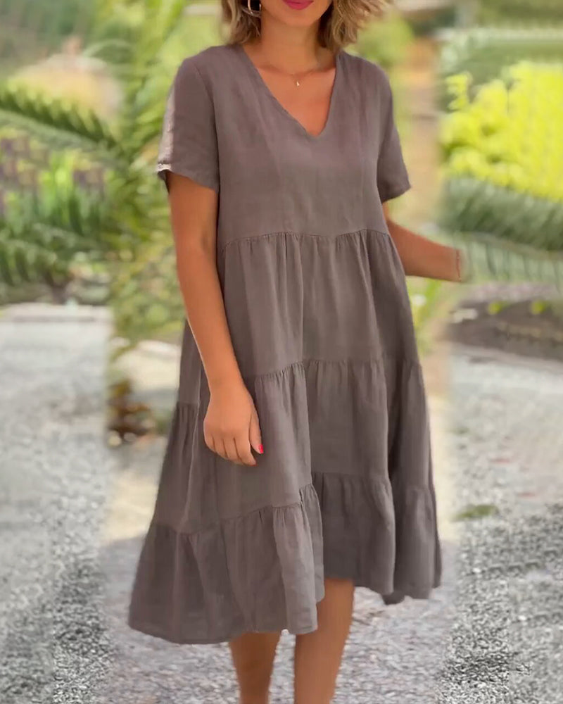 Lucy Sommerkleid, Boho-Chic, V-Ausschnitt, Kurzarm, A-Linie, leichter Stoff, ideal für Sommerpartys und Strandbesuche.
