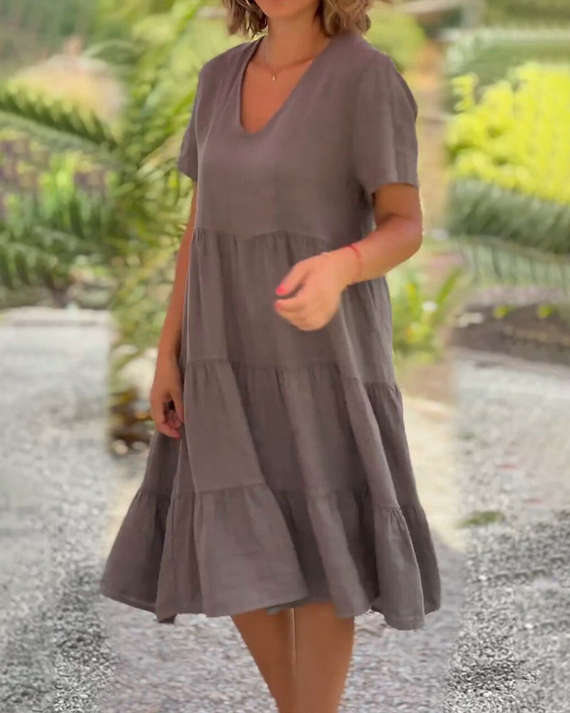 Lucy Sommerkleid, Boho-Chic, V-Ausschnitt, Kurzarm, A-Linie, leichter Stoff, ideal für Sommerpartys und Strandbesuche.