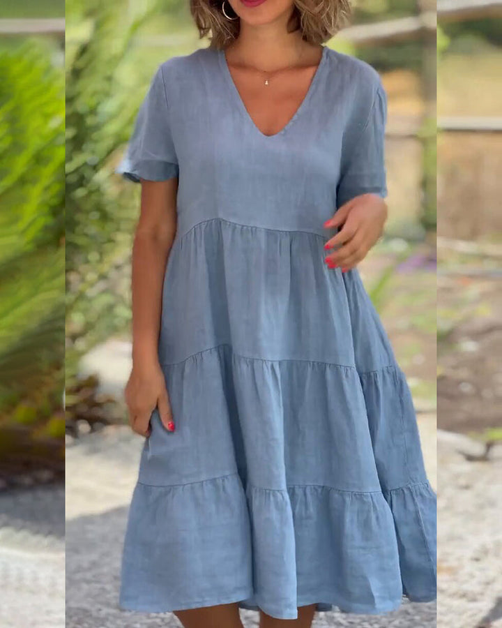 Lucy Sommerkleid, Boho-Chic, V-Ausschnitt, Kurzarm, A-Linie, leichter Stoff, ideal für Sommerpartys und Strandbesuche.