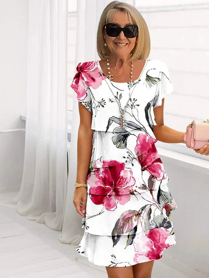 Luftiges Damen Sommerkleid mit floralem Muster, elegante Silhouette, leichte Baumwolle, perfekt für warme Tage.