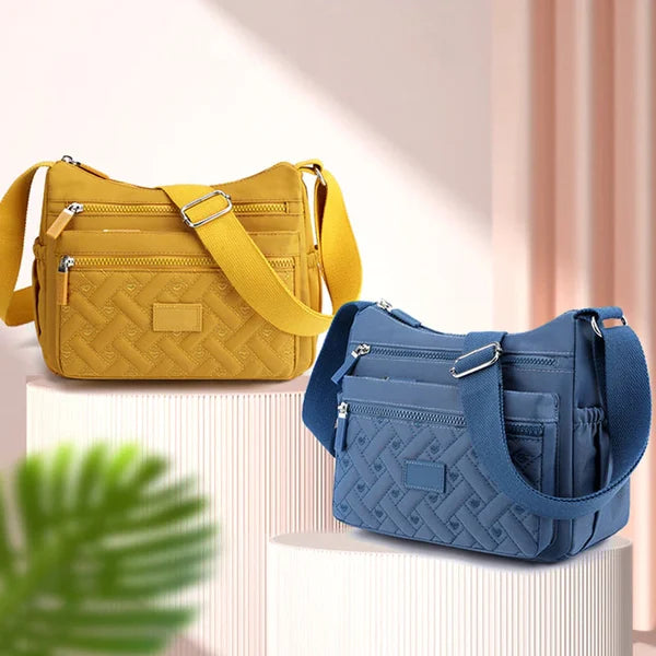 "Luxuriöse Umhängetasche aus wasserdichtem Nylon, stilvoll in verschiedenen Farben, Vorderansicht, ideal für Damen."