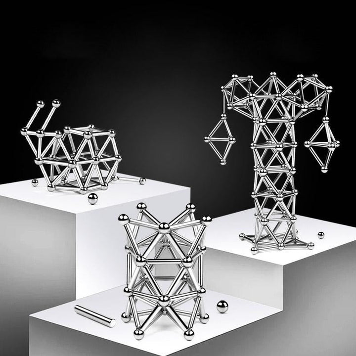 "Magnetische Kugeln und Stäbe in Silber, glänzend, perfekt zum kreativen Gestalten und Stressabbau, aus robusten Materialien.