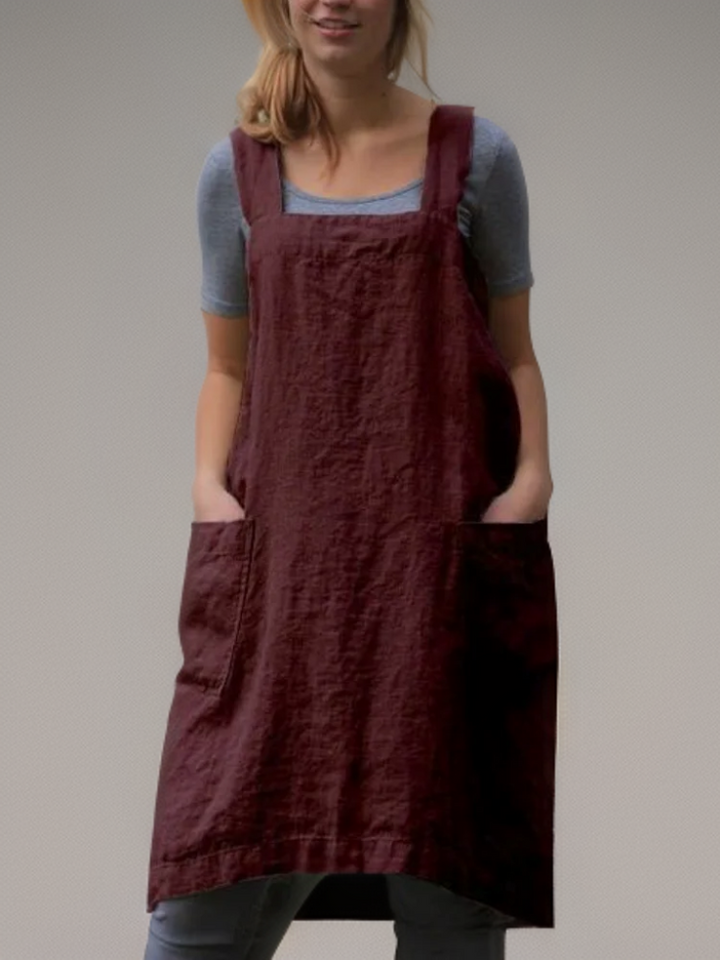"Moderne Heidi Schürze mit Taschen und überkreuztem Rücken, in elegantem Design für vielseitige Nutzung und modischen Stil."