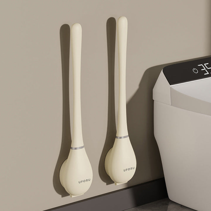 Moderne Silikon-Toilettenbürste, hygienisch, mit flachem Kopf und Wandhalterung, ideal für elegante Badezimmer.