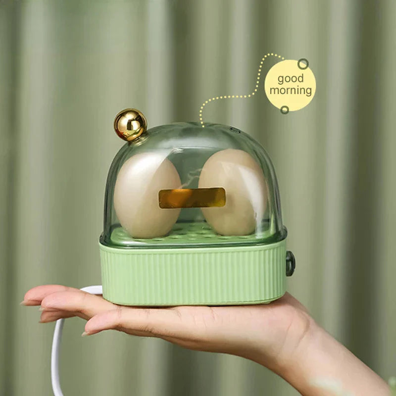 "Moderner elektrischer Eierkocher, 120W, tragbar, kompaktes Design in Grün und Weiß, ideal für Frühstück, einfache Bedienung"