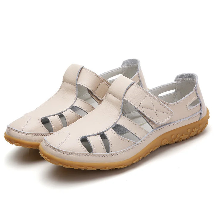 Orthopädische Sandalen mit ergonomischem Fußbett in verschiedenen Farboptionen für Damen, komfortabel und stilvoll.