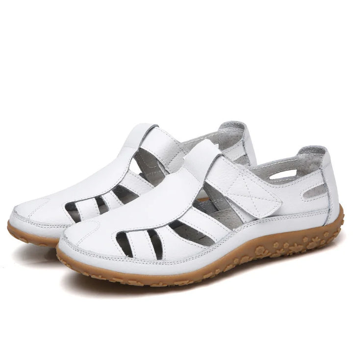 Orthopädische Sandalen mit ergonomischem Fußbett in verschiedenen Farboptionen für Damen, komfortabel und stilvoll.