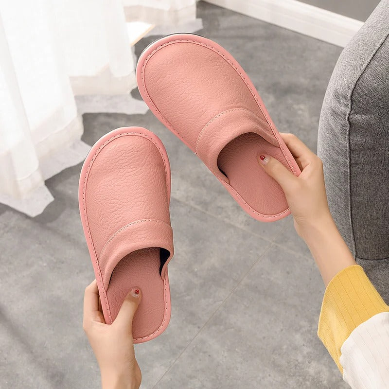 Robuste Lederpantoffeln für Damen und Herren, elegant und langlebig, in Blau, Braun, Orange, Rosa, Rot und Schwarz.