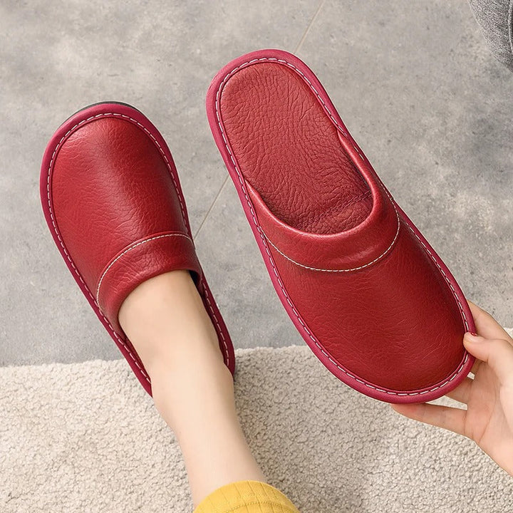 Robuste Lederpantoffeln für Damen und Herren, elegant und langlebig, in Blau, Braun, Orange, Rosa, Rot und Schwarz.