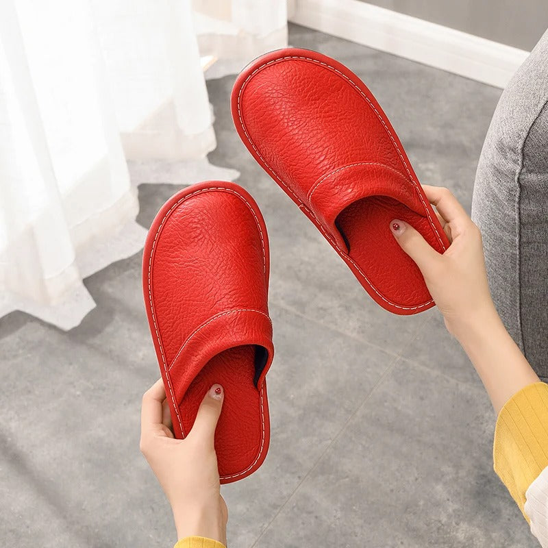 Robuste Lederpantoffeln für Damen und Herren, elegant und langlebig, in Blau, Braun, Orange, Rosa, Rot und Schwarz.