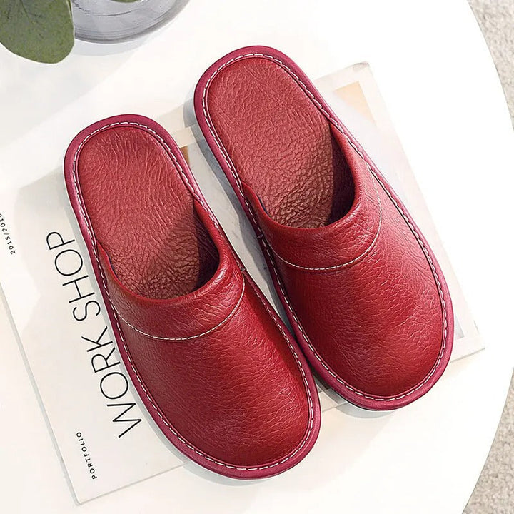 Robuste Lederpantoffeln für Damen und Herren, elegant und langlebig, in Blau, Braun, Orange, Rosa, Rot und Schwarz.