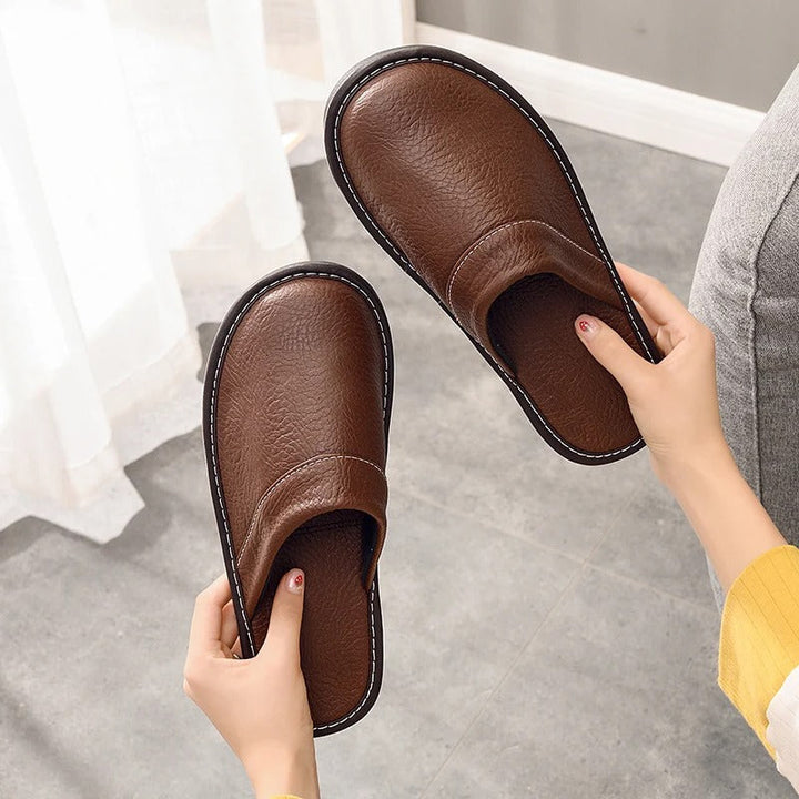Robuste Lederpantoffeln für Damen und Herren, elegant und langlebig, in Blau, Braun, Orange, Rosa, Rot und Schwarz.