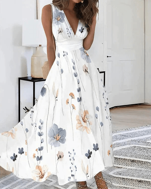 "Romy Blumen V-Ausschnitt Kleid, luftiges Damenkleid mit floralem Muster, betont die Silhouette, ideal für sonnige Tage."
