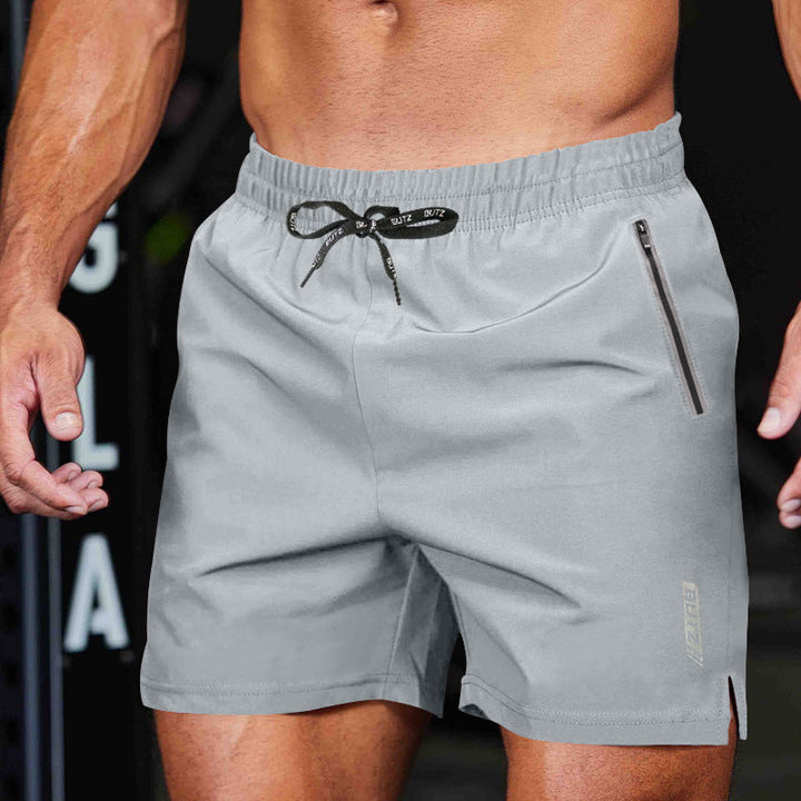 "Schnell trocknende Herren Sport-Shorts, Frontansicht mit Reißverschlusstaschen und elastischem Bund für hohen Komfort"