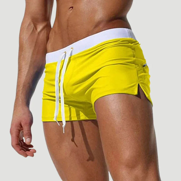 "Schnelltrocknende Herren Badeshorts mit Kordelzug, wasserdicht, blau, ideal für Strand- und Wasseraktivitäten."