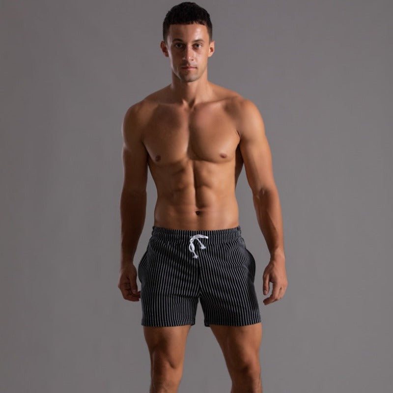 "Schnelltrocknende Herren Badeshorts Ripstop-Polyester in Blau, kurzer Schnitt, elastischer Bund, Frontansicht"
