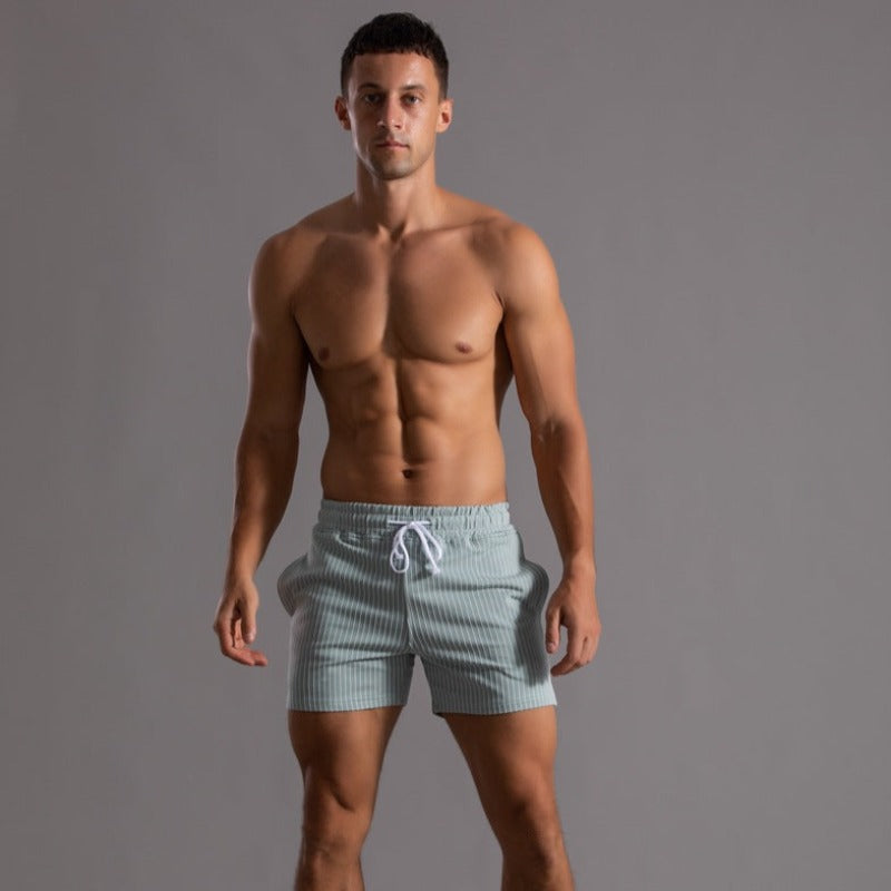 "Schnelltrocknende Herren Badeshorts Ripstop-Polyester in Blau, kurzer Schnitt, elastischer Bund, Frontansicht"