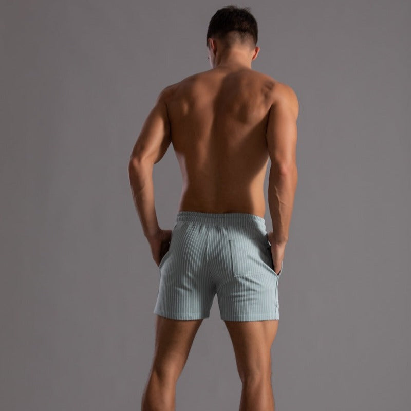 "Schnelltrocknende Herren Badeshorts Ripstop-Polyester in Blau, kurzer Schnitt, elastischer Bund, Frontansicht"