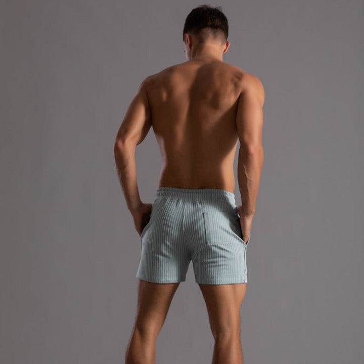 "Schnelltrocknende Herren Badeshorts Ripstop-Polyester in Blau, kurzer Schnitt, elastischer Bund, Frontansicht"