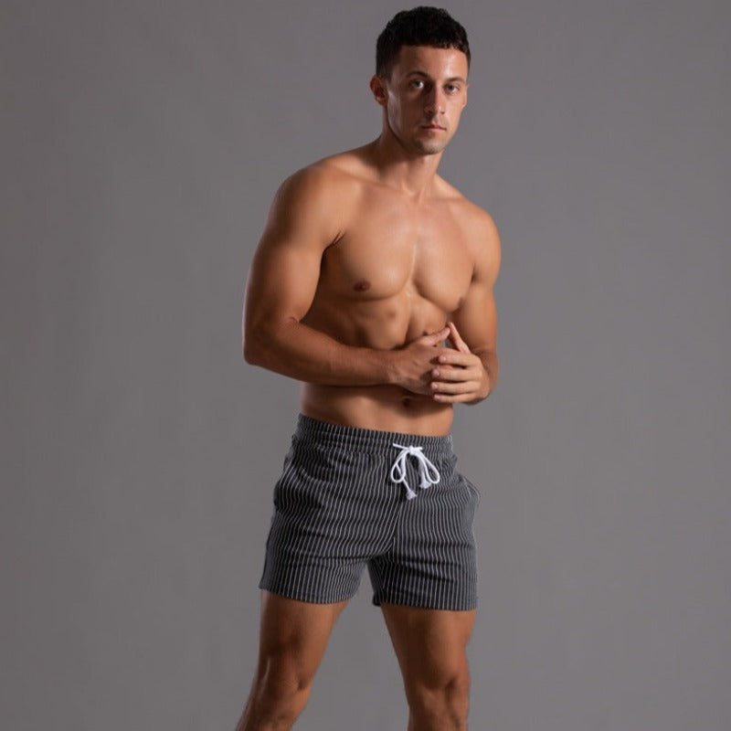 "Schnelltrocknende Herren Badeshorts Ripstop-Polyester in Blau, kurzer Schnitt, elastischer Bund, Frontansicht"