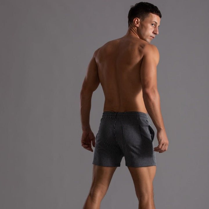 "Schnelltrocknende Herren Badeshorts Ripstop-Polyester in Blau, kurzer Schnitt, elastischer Bund, Frontansicht"