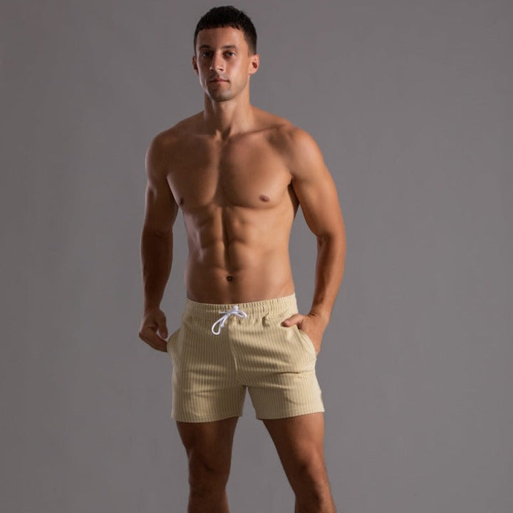 "Schnelltrocknende Herren Badeshorts Ripstop-Polyester in Blau, kurzer Schnitt, elastischer Bund, Frontansicht"