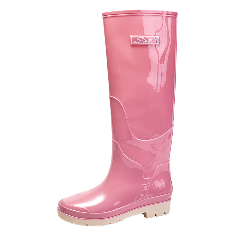 "Schwarze Damen Gummistiefel, wasserdicht, rutschfest, mit robuster Sohle, elegantes Design für Regenwetter."
