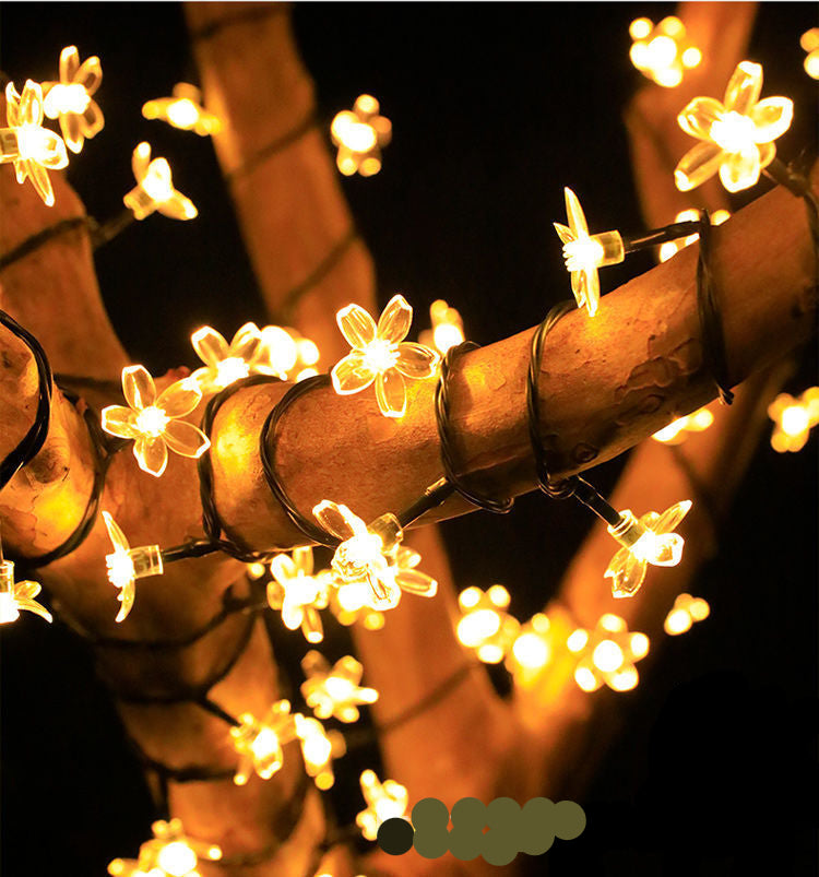 "Solar Gartenlichterkette in Blumenform, wetterfest, elegantes Ambiente, ideal für Gartenpartys und Outdoor-Nutzung."