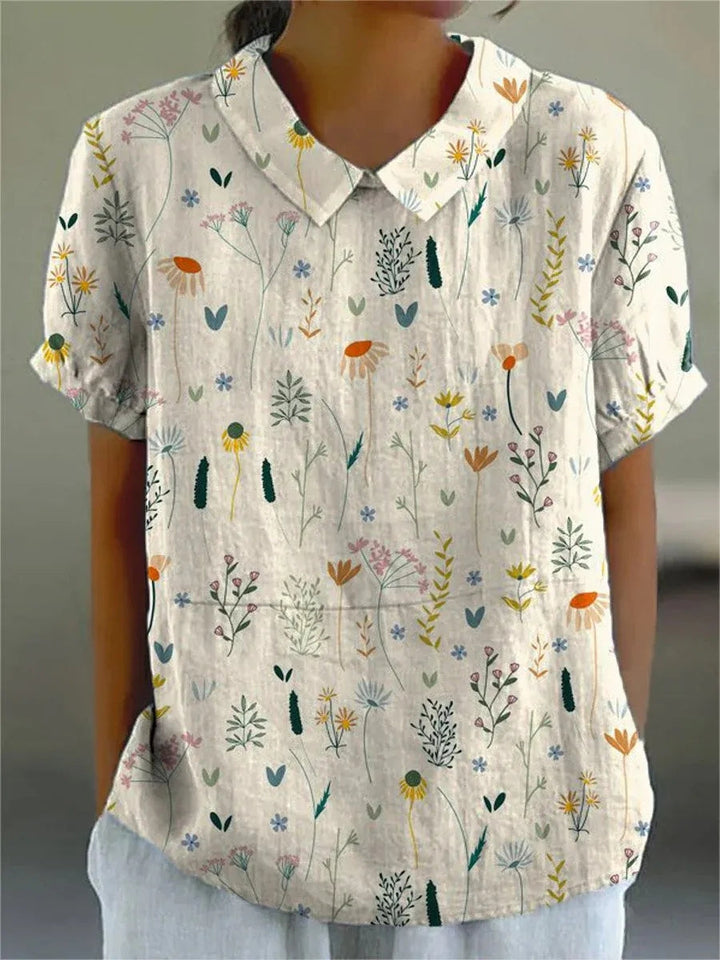 "Sommerbluse mit Wildblumenmuster, pastellfarben, locker geschnitten, ideal für warme Tage; Damenmode, stilvoll und bequem."