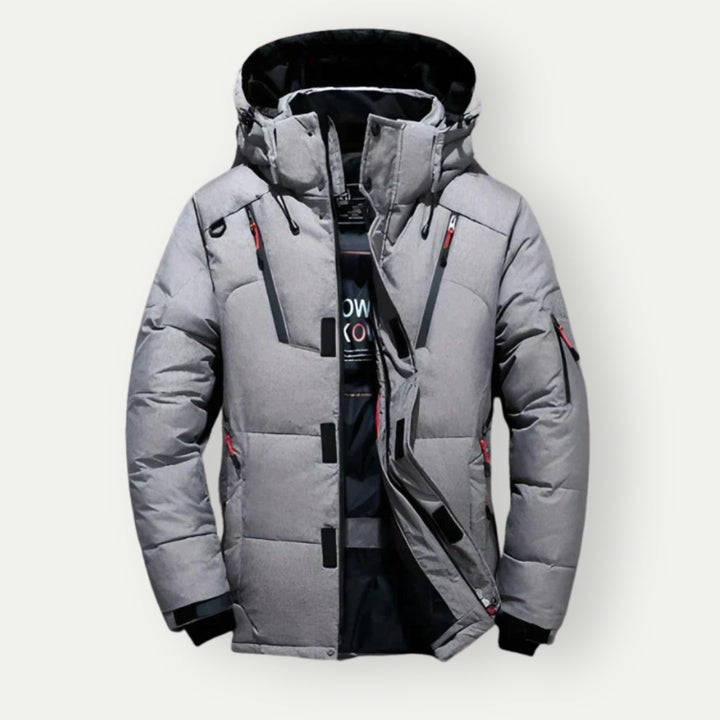 Stilvolle Herren Daunenjacke, farbenfroh in Blau, Grau, Grün, mit eleganter Silhouette und funktionaler Isolierung.