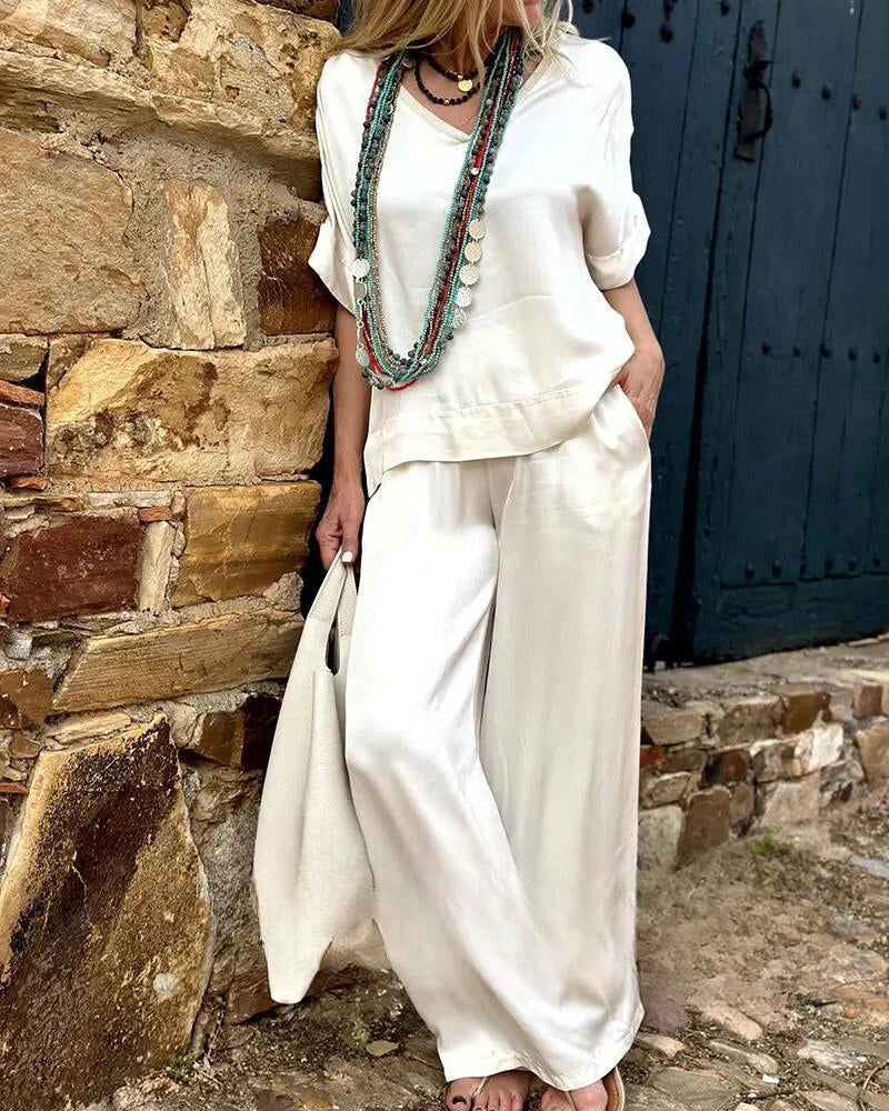 Stilvolles Damen Zweiteiler Set in Beige, lockerer Schnitt, bestehend aus Oberteil und Hose, modisch und bequem.