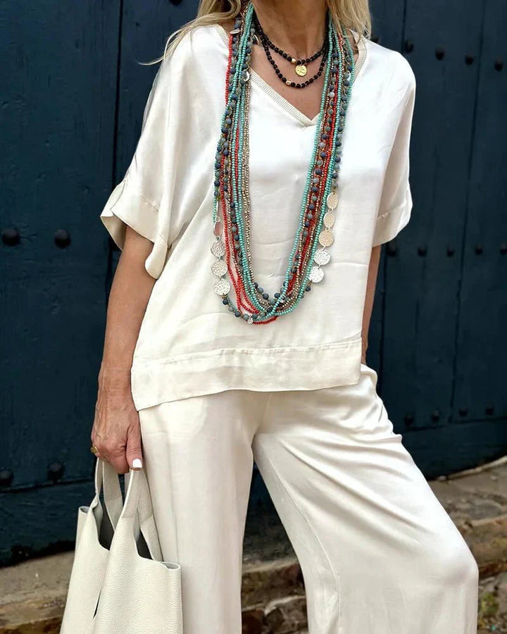 Stilvolles Damen Zweiteiler Set in Beige, lockerer Schnitt, bestehend aus Oberteil und Hose, modisch und bequem.