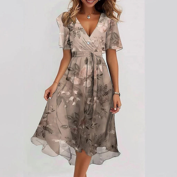 Stilvolles Midi Kleid mit Blumenmuster, elegante Passform, ideal für jeden Anlass, komfortabel und zeitlos.