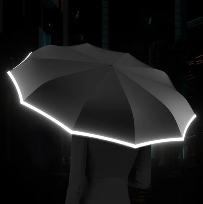 "Sturmsicherer, kompakter Regenschirm mit reflektierender Kante für Sichtbarkeit bei Dunkelheit, ideal für stürmisches Wetter
