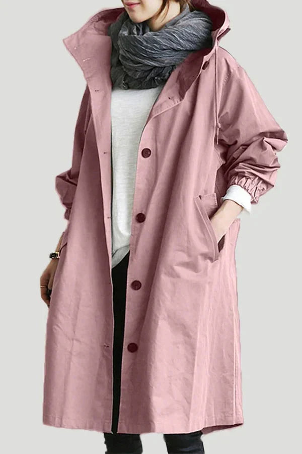 Stylischer Damen-Regenmantel mit Kapuze und übergroßer Passform, wasserabweisend und ideal für regnerische Tage.